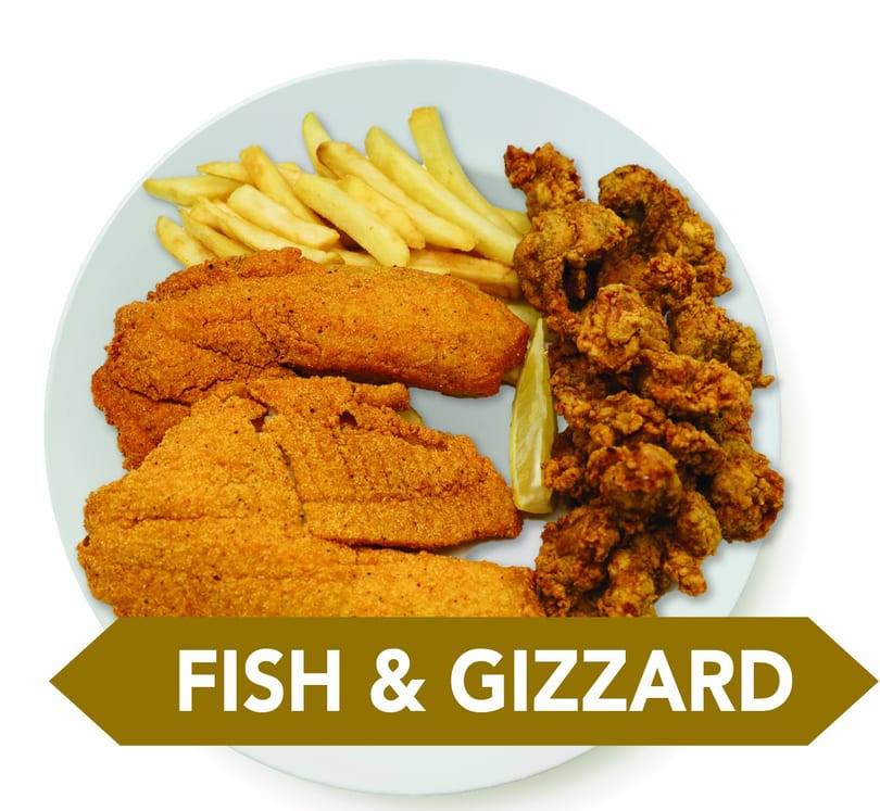 Fried fish fillets, crispy gizzards, french fries, and a lemon wedge on a white plate.